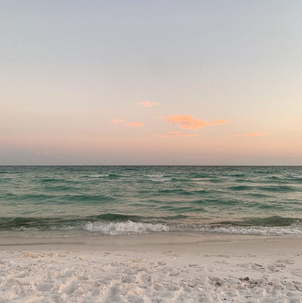 Sugar-white sand and emerald-green Gulf water on a 30A beach in Florida used to compare Rosemary Beach vs Seaside vs Alys Beach