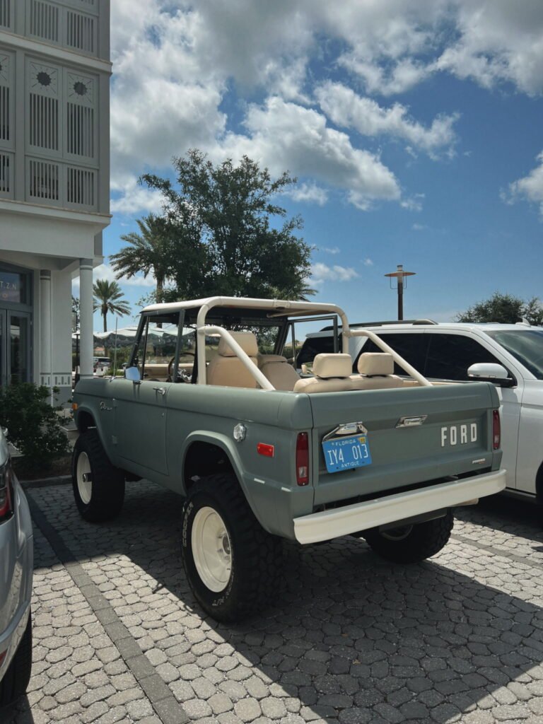 Parked vintage Ford Bronco in 30A Florida used to compare getting around Rosemary Beach vs Seaside vs Alys Beach