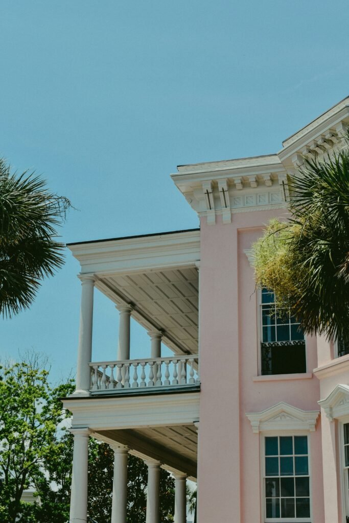 Pink House with large side porch to show architecture of homes in Charleston South Carolina as part of a Charleston Travel Guide